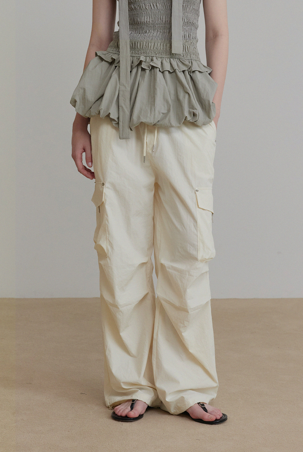MUSINSA | TWEE Stone Rivet Banding Cargo Parachute Pants