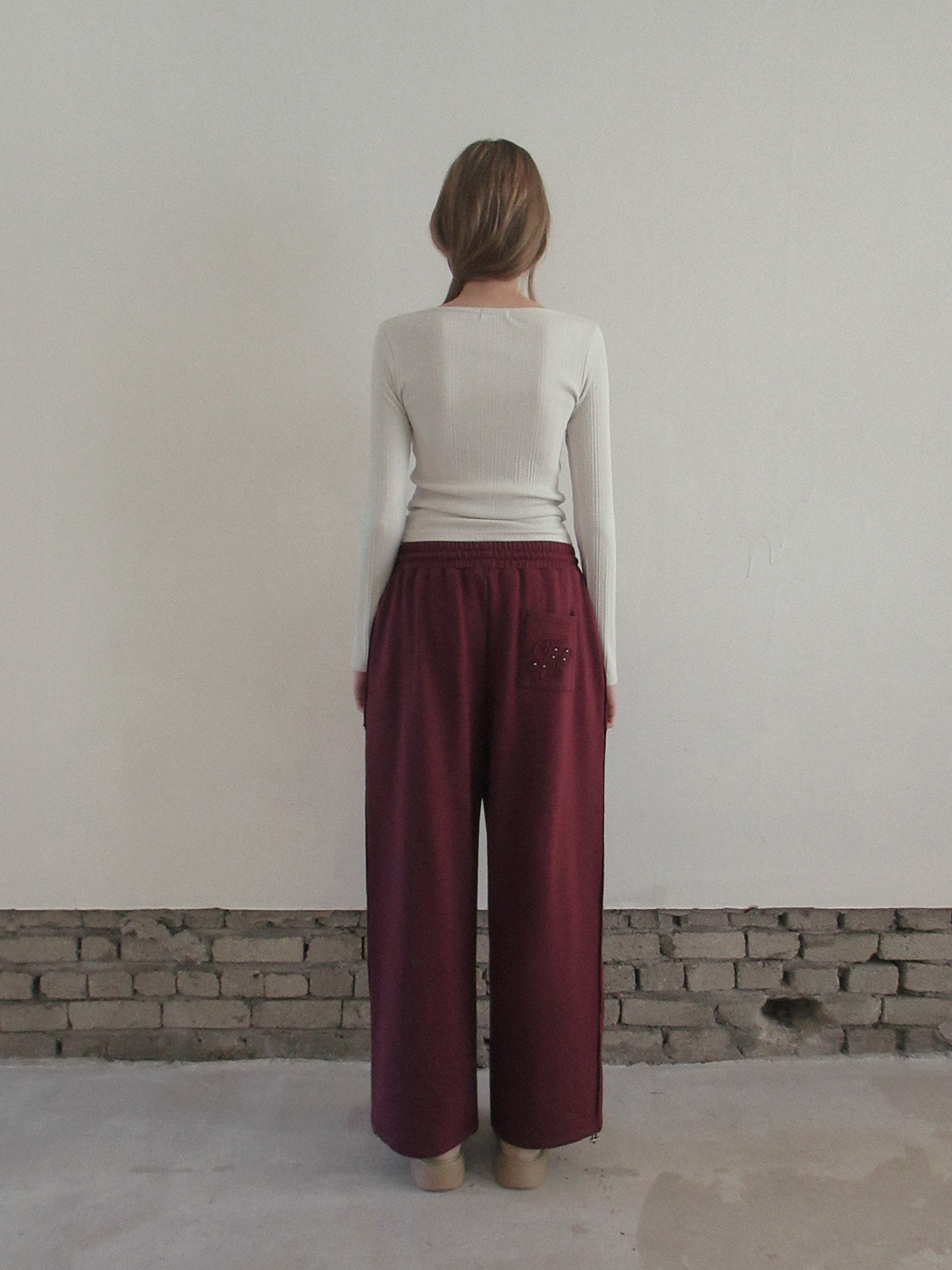 TWEE Reven stud banding long sweatpants - Model styling view