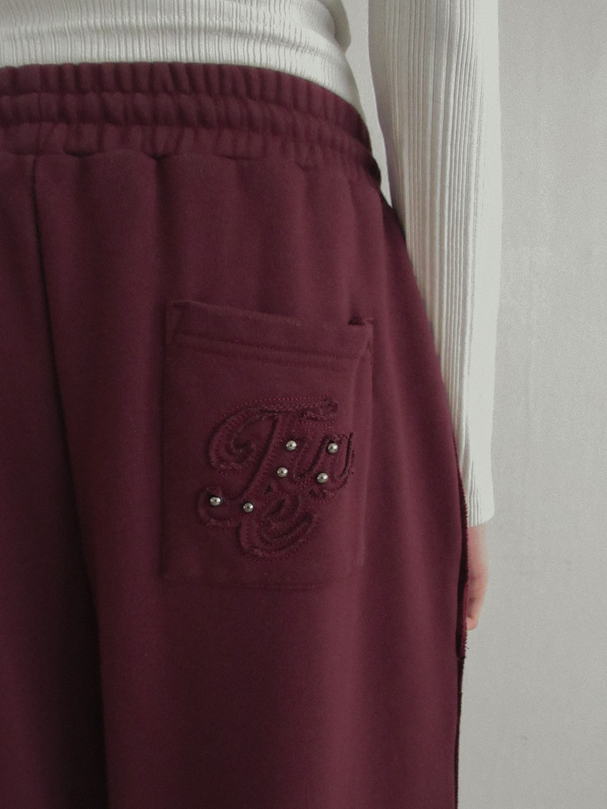 TWEE Reven stud banding long sweatpants - Model styling view