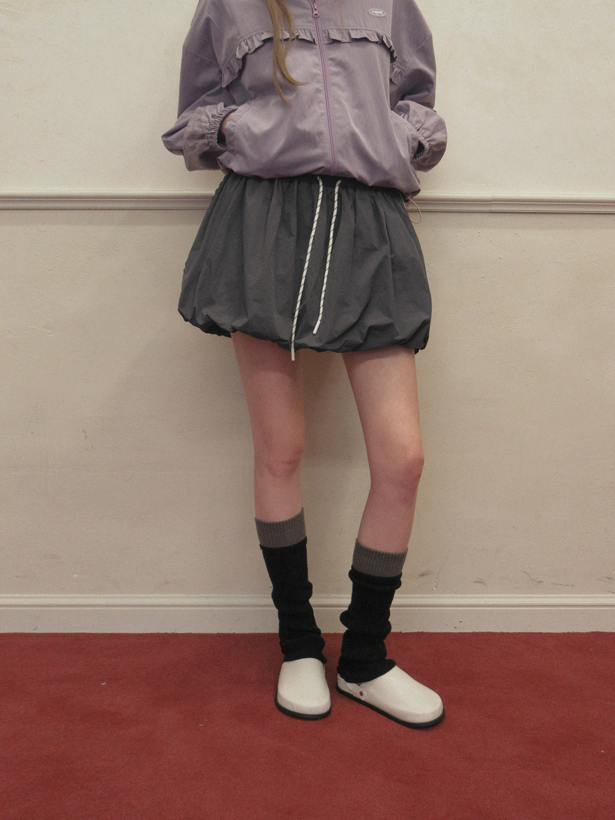 TWEE Colt nylon balloon banding mini skirt - Model styling view